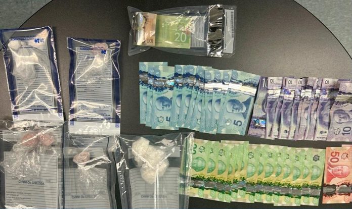 Illegal drugs and currency seized by Kawartha Lakes police after executing a search warrant at a Lindsay home on January 10, 2022. (Photo: Kawartha Lakes Police Service)