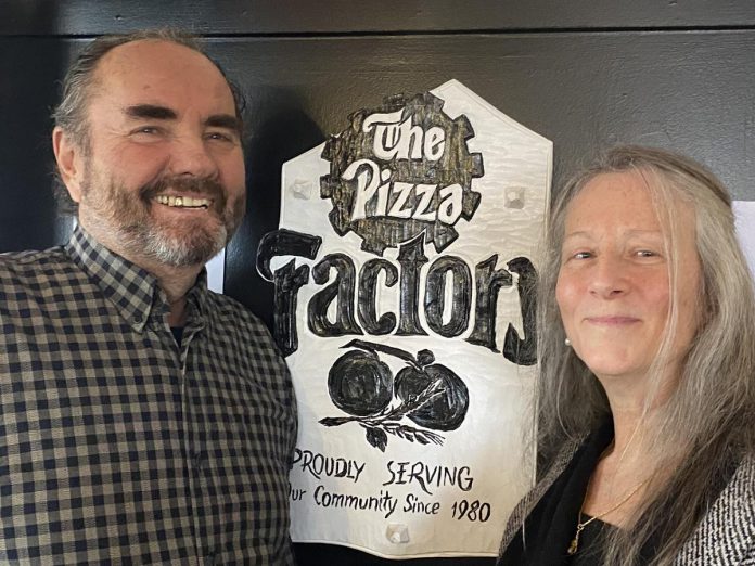 Peter and Anna Bouzinelos, owners of The Pizza Factory at 1000 Lansdowne Street West in Peterborough, are closing the iconic restaurant on January 29, 2023 after almost 43 years in business. (Photo: Paul Rellinger / kawarthaNOW)