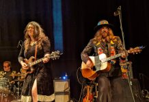 Juno-nominated singer-songwriter and guitarist Terra Lightfoot performing with Tom Wilson of Blackie and the Rodeo Kings at Peterborough's Market Hall on December 7, 2022. Originally from Hamilton, the roots-rocker is now living in Haliburton County and will peform for the first time in her new hometown on January 28, 2023. (Photo: Bruce Head / kawarthaNOW)