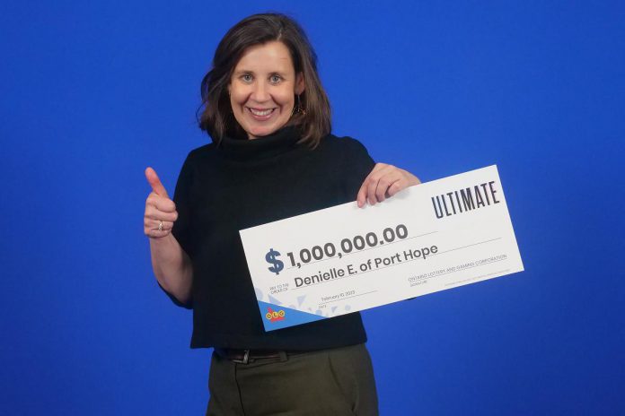 Denielle Elliott of Port Hope picking up her $1 million prize at the OLG prize centre in Toronto. (Photo: OLG)