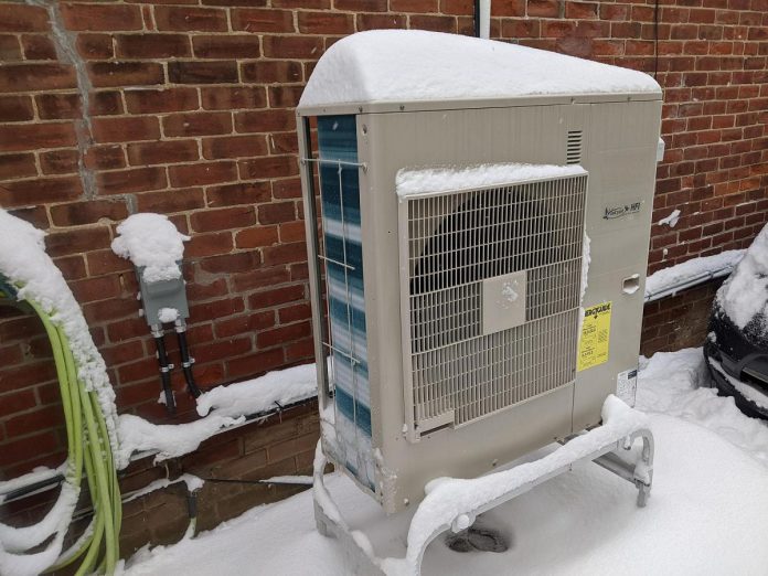 Many homeowners are switching to cold-climate air-source heat pumps, shown here, to save money and to keep their home warm during the winter while remaining climate-conscious. (Photo: Clara Blakelock / GreenUP)