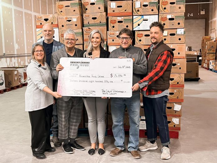 City of Peterborough Town Ward councillors Joy Lachica and Alex Bierk (third from left and far right) and William Wolfe of Wolfe Personal Injury Lawyers (second from left) presented a cheque for $13,851.95 to Kawartha Food Share general manager Ashlee Aitken (third from right) on February 8, 2023. The funds were parking fees donated by drivers in downtown Peterborough during the city's two-hour free holiday parking promotion. (Photo: Kawartha Food Share / Facebook)