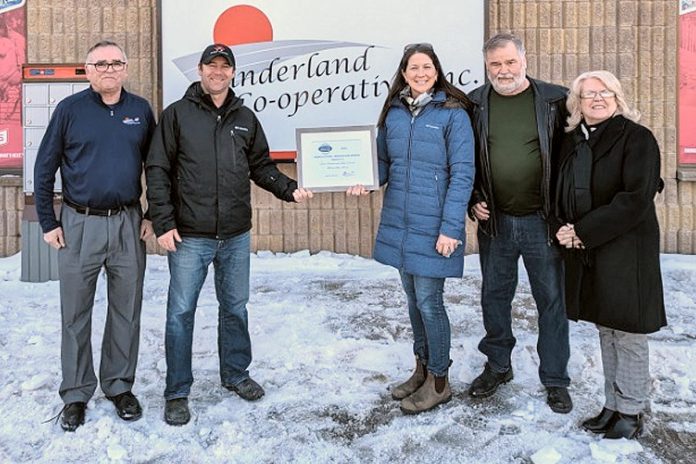 Kevin Cornish and Janet Dawson (second and third from left) of Indian River Acres in Peterborough County were honoured at Sunderland Co-operative Inc. on February 6, 2023 with the inaugural Peterborough Agricultural Innovation Award for their sustainable method of farming pumpkins. Also pictured are Garth Stoner from Sunderland Co-op (left), Elmer Buchanan from the Peterborough Agricultural Roundtable, and Peterborough County Warden Bonnie Clark. (Photo courtesy of Peterborough Agricultural Roundtable)