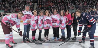 Five local hockey moms and Pink In The Rink campaign ambassadors (Jennie Ireland, Dara Gosselin, Elke Rye, Karen Tarkington, and Dana Thorn) joined PRHC Foundation president and CEO Leslie Heighway and PRHC oncologist Dr. Neera Jeyabalan for a ceremony before the 14th annual cancer fundraising game on February 4, 2023. (Photo: Kenneth Anderson Photography