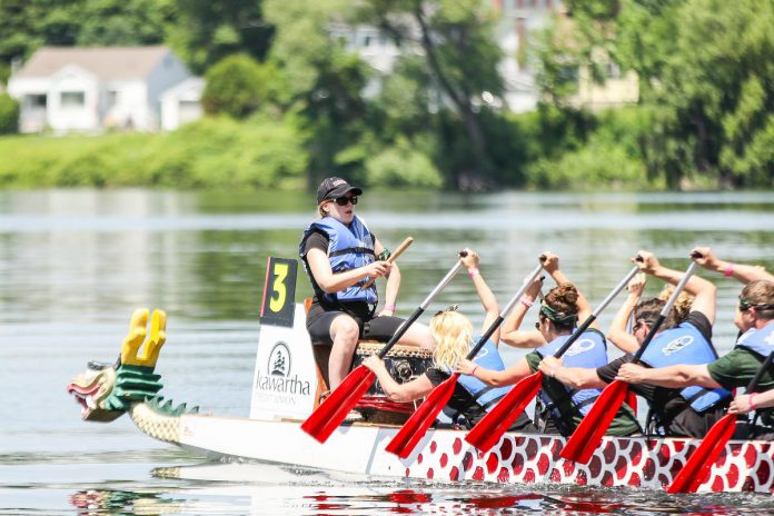 A dragon boat team races at Peterborough's Dragon Boat Festival in 2015. Since 2001, the annual festival has raised more than $3.9 million for cancer care at Peterborough Regional Health Centre. (Photo: Linda McIlwain / kawarthaNOW)