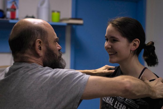 Brad Brackenridge tries out a wrestling move on Sam Weatherdon during a rehearsal for "Ring Rats", which tells the story of a broken-down former professional wrestler hired to train a young woman. Written and directed Derek Weatherdon, the fourth original play from Planet 12 Productions runs at The Theatre On King in downtown Peterborough from February 22 to 25, 2023. (Photo: Adam Martignetti)