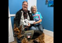 Hastings resident Mark Cameron, president and cofounder of the Canadian International Medical Relief Organization (CIMRO), accepts a $2,250 donation from Dr. Kristy Hiltz of Sherbrooke Heights Animal Hospital that will allow CIMRO to purchase 15 boxes of suture material to help repair wounds of those injured during the the February 6th magnitude 7.8 earthquake in southern Turkey and northern Syria. Also pictured is CIMRO's disaster response service dog Zaria. (Photo courtesy of Sherbrooke Heights Animal Hospital)