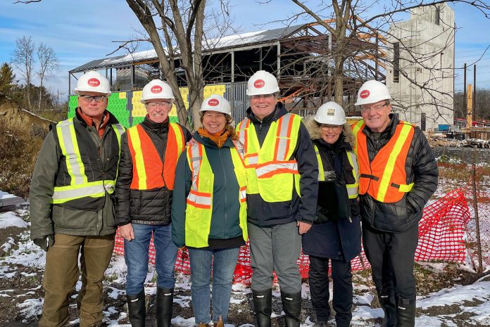 Former CFL player and businessman Stuart "Stu" Lang and his wife Kim have made a $1,775,000 gift to The Canadian Canoe Museum. Pictured is Stu Lang (third from right) during a site visit to the museum currently under construction at 2077 Ashburnham Drive. Also pictured from left to right are museum curator Jeremy Ward, fundraising cabinet volunteer Rodger Wright, museum executive director Carolyn Hyslop,  Basterfield & Associates Ltd. landscape architect Helen Batten, and fundraising cabinet volunteer David Hadden. (Photo courtesy of The Canadian Canoe Museum)