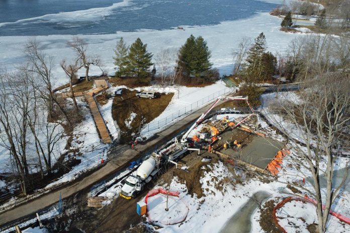 An aerial view of the lakefront campus of The Canadian Canoe Museum from February 13, 2023, showing the construction of the boardwalk and the Canoe House alongside the existing Trans Canada Trail. (Photo courtesy of The Canadian Canoe Museum)