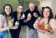 The Peterborough Downtown Business Improvement Area (DBIA) has announced its new 'The Golden Goose Chase' retail incentive program during April and May that rewards shoppers who find 'golden eggs' designed by local artists that are hidden at more than 50 participating downtown retailers. Pictured from left to right: DBIA intern Whitney Paget, Peterborough and the Kawarthas Tourism visitor experience officer Jocelyn Gilmour, DBIA executive director Terry Guiel, and DBIA communications and marketing manager Hillary Flood. (Photo courtesy of Peterborough DBIA)