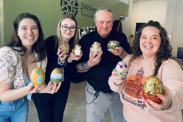 The Peterborough Downtown Business Improvement Area (DBIA) has announced its new 'The Golden Goose Chase' retail incentive program during April and May that rewards shoppers who find 'golden eggs' designed by local artists that are hidden at more than 50 participating downtown retailers. Pictured from left to right: DBIA intern Whitney Paget, Peterborough and the Kawarthas Tourism visitor experience officer Jocelyn Gilmour, DBIA executive director Terry Guiel, and DBIA communications and marketing manager Hillary Flood. (Photo courtesy of Peterborough DBIA)
