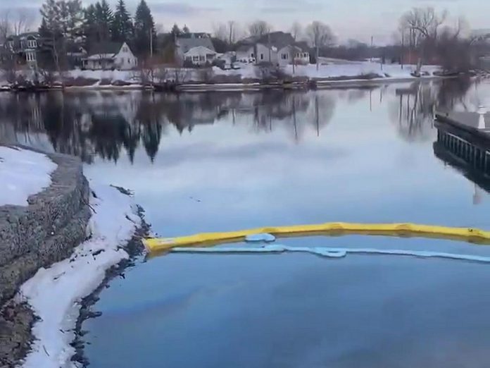 Containment barriers in place for a fuel oil spill, discovered on March 16, 2023, at the south end of Jackson Creek where it empties into Little Lake in downtown Peterborough. (kawarthaNOW screenshot of video by Christina Abbott)