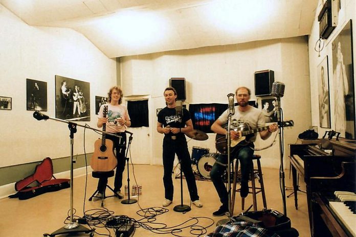 A young Rick Fines, Al Black, and Gary Peeples recording their first Jackson Delta record, "Delta Sunrise", at Sun Studio in Memphis, Tennessee in 1988. (Photo courtesy of Jackson Delta)