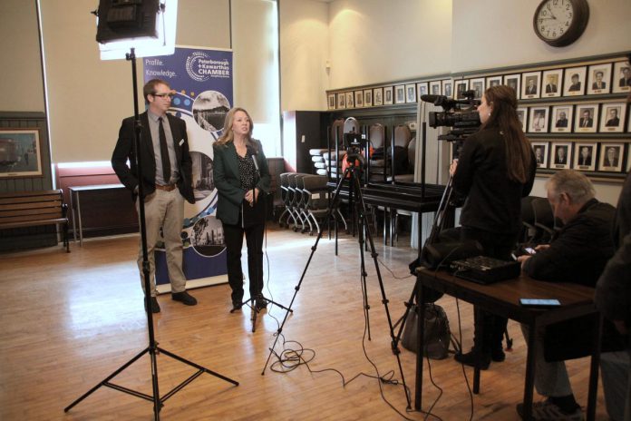 Ontario NDP leader Marit Stiles addresses the media during a stop at the Peterborough and the Kawarthas Chamber of Commerce office in downtown Peterborough on March 14, 2023 while Joel Wiebe, the Chamber's vice president of government relations and communications, looks on. (Photo: Jeannine Taylor / kawarthaNOW)