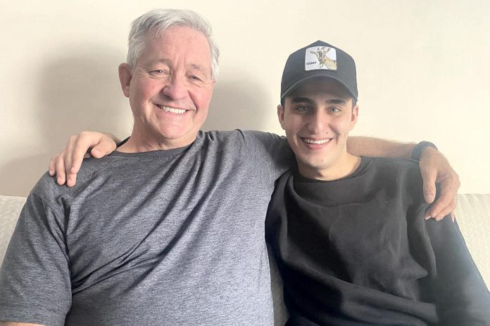 19-year-old Syrian refugee Rashid with Dave McNab, who was instrumental in reaching out to Rashid while he was living in Turkey, helping Rashid learn English, and in sponsoring him to come to Canada from Turkey, where he was living under fear of deportation after fleeing Syria in 2020. (Photo: Paul Rellinger / kawarthaNOW)