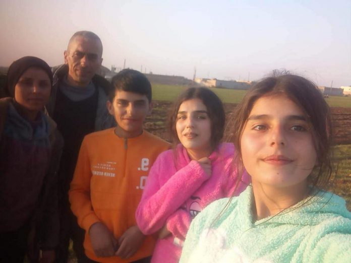 Rashid's parents, brother, and two sisters share a selfie with Rashid on February 22, 2023. For almost nine years, they feared he was dead and he feared they were dead.  (Photo courtesy of Dave McNab)