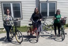A Place Called Home's emergency shelter in Lindsay is now offering a free bike share program for its residents thanks to a grant from the United Way for the City of Kawartha Lakes. Pictured with the four bikes and bike rack are Jen Lopinski of A Place Called Home (left) along with Shantal Ingram and Jennifer Bain of the United Way. (Photo courtesy of A Place Called Home)