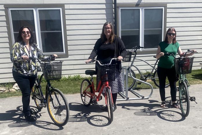 A Place Called Home's emergency shelter in Lindsay is now offering a free bike share program for its residents thanks to a grant from the United Way for the City of Kawartha Lakes. Pictured with the four bikes and bike rack are Jen Lopinski of A Place Called Home (left) along with Shantal Ingram and Jennifer Bain of the United Way. (Photo courtesy of A Place Called Home)