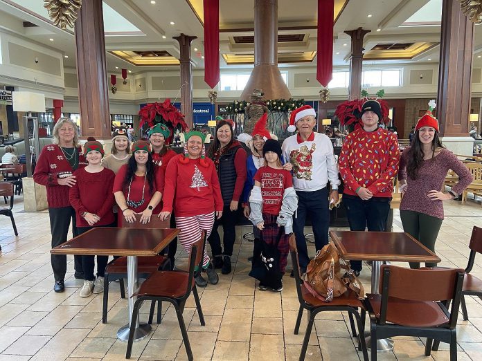 Volunteers make all the difference at Five Counties Children's Centre, including Bob (third from right) who was among the many volunteers who helped out at the Santa's Breakfast fundraiser for Five Counties at Lansdowne Place in Peterborough in November 2022. (Photo courtesy of Five Counties Children's Centre)