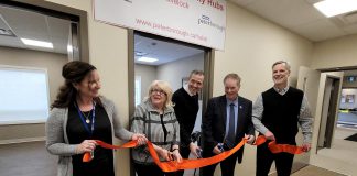 Community Care Peterborough executive director Danielle Belair, Peterborough County warden Bonnie Clark, Peterborough city councillor Matt Crowley, Havelock-Belmont-Methuen Township mayor Jim Martin, and City of Peterborough community development program manager Chris Kawalec cut the ribbon to officially open the Havelock Health and Community Services Hub on April 4, 2023. The hub is located in the Peterborough Housing Corporation building on Smith Drive, right next to the Community Care Peterborough service office in Havelock. (Photo: Community Care Havelock)