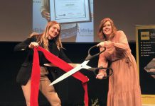 Madeleine Hurrell (right), Manager of Peterborough & the Kawarthas Economic Development's Business Advisory Centre, and Ella Fischer-Slack (left), Business Advisory Centre Coordinator, cut the ribbon at a recent event that showcased 24 entrepreneuers who participated in the Starter Company Plus program during the pandemic. Applications for the spring 2023 intake of the entrepreneurial training program close on April 30. (Photo courtesy of Peterborough & the Kawarthas Economic Development)