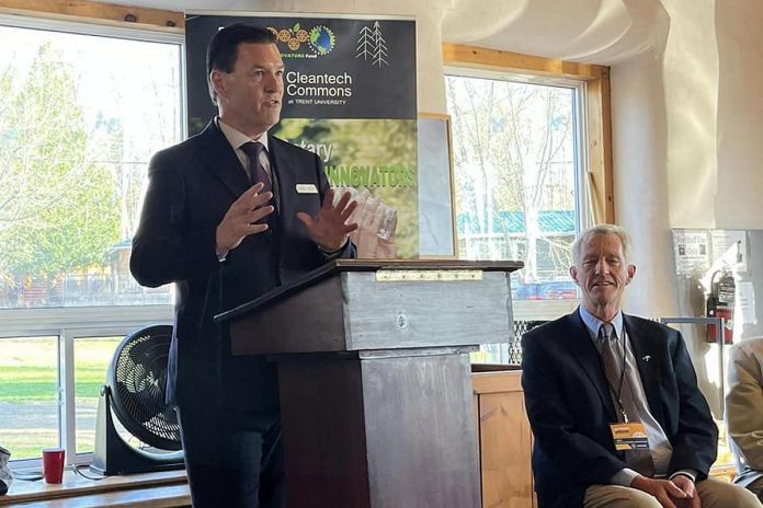 Martin Yuill, executive director of Cleantech Commons of Trent University, speaks at the inaugural Rotary Environmental Innovators Award event on April 27, 2023 at Camp Kawartha in Douro-Dummer as Rotarian Graham Wilkins, who is leading the Rotary Environmentalist Innovators Fund (REIF) initiative, looks on.  Cleantech Commons parterned with the Rotary Club of Peterborough earlier this year in support of REIF. (Photo: Community Futures Peterborough / Facebook)