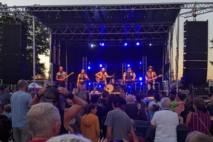 The Strumbellas perform at Peterborough Musicfest in August 2022 on a temporary stage after the City of Peterborough deemed the the Fred Anderson Stage to be unsafe. The City of Peterborough will install a new mobile stage in time for Musicfest's 2023 summer season. (Photo: Bruce Head / kawarthaNOW)