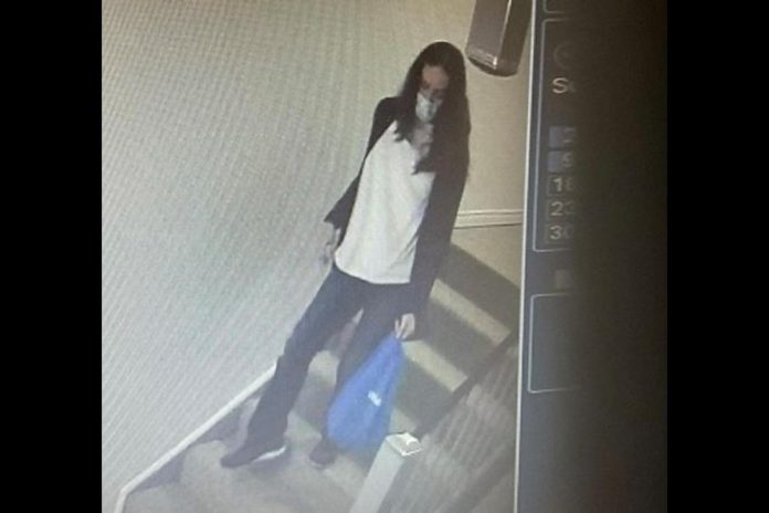 The female suspect in a theft of cash from an apartement in a condominium building on Heritage Way in Lindsay on April 12, 2023. (Police-supplied photo)