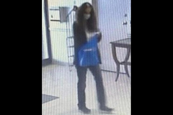 The female suspect in a theft of cash from an apartement in a condominium building on Heritage Way in Lindsay on April 12, 2023. (Police-supplied photo)