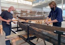 The Canadian Canoe Museum's curator Jeremy Ward (left) and collections assistant Nicholas VanExan build a steel cradle for one of the more than 600 watercraft that will be moved from the museum's Monaghan Road location to the museum's new home currently under construction at the water's edge on Little Lake in the heart of Peterborough. (Photo courtesy of The Canadian Canoe Museum)