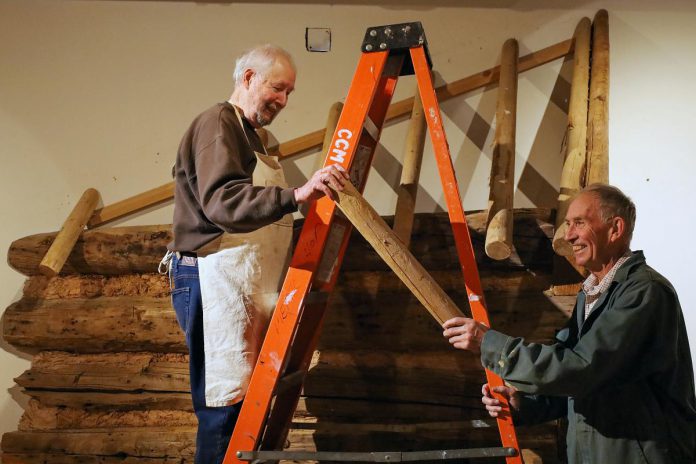 Two volunteers dismantle exhibit scenery at The Canadian Canoe Museum's Monaghan Road location, in preparation for the museum's move to its new home currently under construction at the water's edge on Little Lake in the heart of Peterborough. Many of the volunteers helping with preparation have been volunteering for more than two decades, with some even from the days when Professor Wipper's collection moved to Peterborough in the 1990s before The Canadian Canoe Museum opened for the first time. (Photo courtesy of The Canadian Canoe Museum)