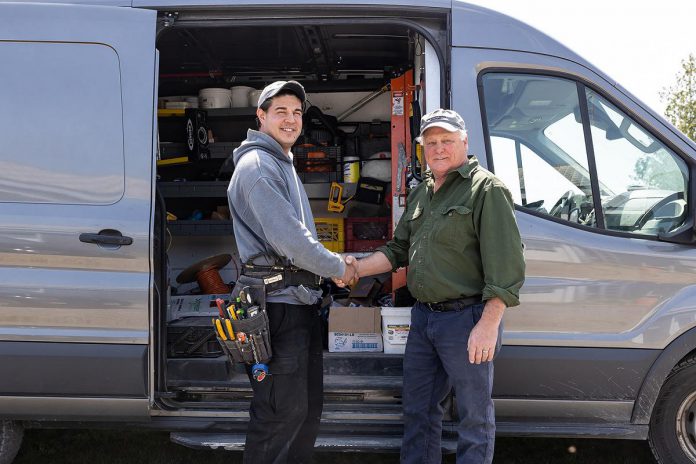 Entrepreneur Brad Bourrie (left) has purchased White Electric from Gord White (right), who founded the company in 1978. Bourrie, whose mother is from Garden River First Nation near Sault Ste. Marie, apprenticed with White for almost eight years before obtaining his electrician license. Community Futures Peterborough provided Bourrie with financing and support so he could take over the business from the retiring White. (Photo: Heather Doughty Photography)