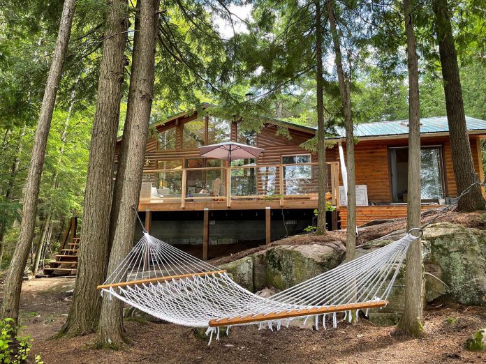 Full of traditional and modern charm, this cottage on Crego Lake in the northeast corner of Kawartha Lakes near Kinmount features three bedrooms and soaring ceilings with tons of natural light.  (Photo courtesy of Cottage Vacations)