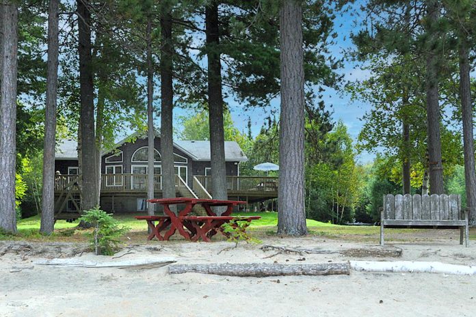 Cottage Vacations properties range from deep to shallow entry. Finding a cottage to suit your group's needs has never been easier. Located near Wilberforce on Grace Lake, this cottage features a large sandy beach for guests to enjoy. (Photo courtesy of Cottage Vacations)