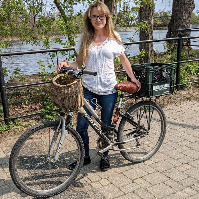 Hailey Finlay, owner of Very Important Pet (VIP) Peterborough, uses her bicycle as a low-cost and environmentally friendly method of increasing her business's service area while also helping reduce her stress and anxiety before she meets with her clients.  (Photo: Hailey Finlay / VIP Peterborough)