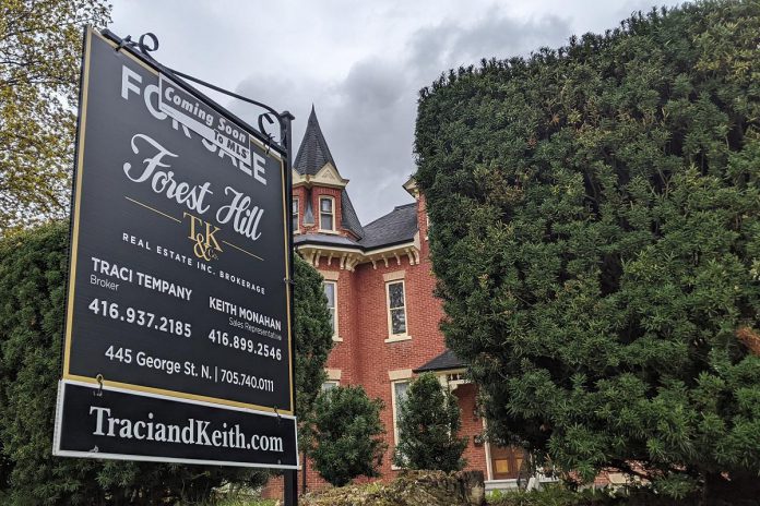 A real estate sign with a "coming soon to MLS" label was recently placed in the John C. Sullivan House at 83 Robinson Street in Peterborough's East City. (Photo: Bruce Head / kawarthaNOW)