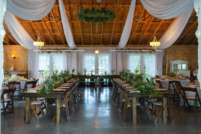 The 150-seat reception hall at Northview Gardens offers spacious yet cozy ambiance with natural lighting, cathedral ceilings, and fairy lights. With a large dance floor and plenty of rental options, guests can customize the space to suit their event. (Photo courtesy of Northview Gardens)