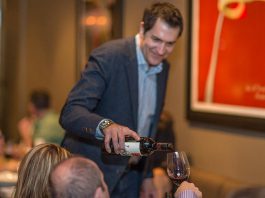 Louis Karkabasis, owner and sommelier of Pane Vino Trattoria & Wine Bar in Lindsay, serves a customer at the popular Italian restaurant, which will be closing after May 27, 2023. (Photo via Pane Vito website)