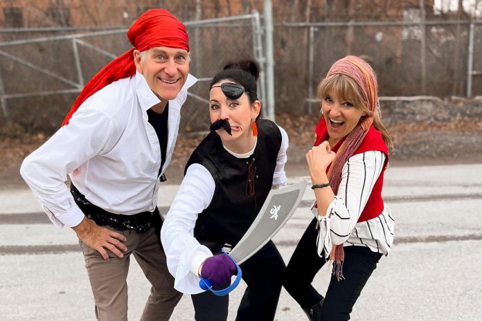 Peterborough's Dan Duran, Megan Murphy, and Lisa Devan get in the spirit to prepare for the seventh Porch Pirates for Good porch food drive on May 27, 2023. On Saturday morning, people are asked to leave a bag of non-perishable food items on their front porch, which will be collected by volunteers to deliver to the Kawartha Food Share warehouse. (Photo courtesy of Kawartha Food Share)