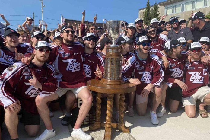 Members of the Ontario Hockey League champion Peterborough Petes gathered round the J. Robertson Cup Monday (May 22) at Quaker Foods City Square in downtown Peterborough. The community celebration of the Memorial Cup-bound Petes drew well more than 500 exuberant supporters of the team less than 24 hours after the Petes downed the London Knights 2-1 to punch their ticket to the 103rd Canadian junior hockey championship in Kamloops, B.C. (Photo: Paul Rellinger / kawarthaNOW)