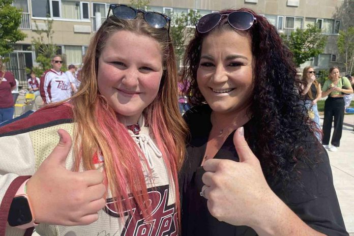 Samantha and Angele Westlake were determined not to miss the community celebration of the Peterborough Petes' Ontario Hockey League championship held Monday (May 22) at Quaker Foods City Square. They joined well more than 500 team supporters who jammed the downtown public space. (Photo: Paul Rellinger / kawarthaNOW)