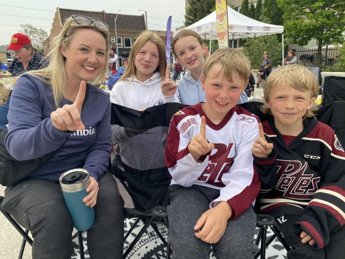 Making sure all knew who number one in their hearts is were these young Peterborough Petes fans, brought by Ashley Woollacott from Ennismore to Quaker Foods City Square in downtown Peterborough for the community watch party held May 19, 2023. Despite the Petes ultimately falling to the London Knights 4-1, forcing a sixth game on Sunday, fans young and old alike enjoyed the outdoor experience. (Photo: Paul Rellinger / kawarthaNOW)