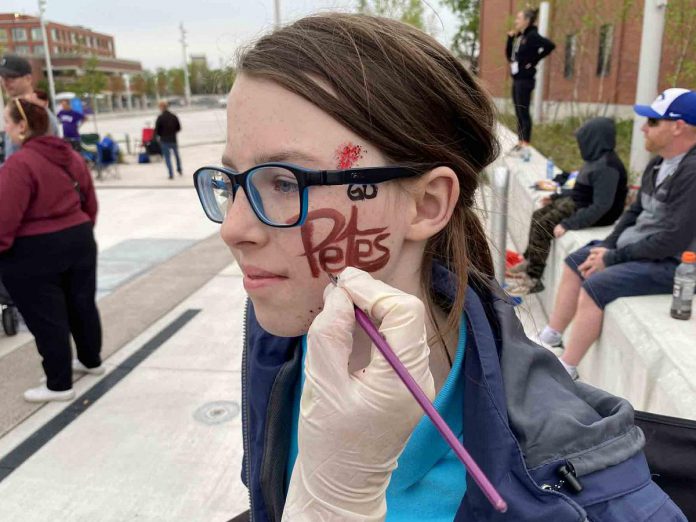 Winter McCoy of Peterborough took time to have her allegiance to the Peterborough Petes properly displayed. She attended the Peterborough Petes community watch party held  on May 19, 2023,  at Quaker Foods City Square in downtown Peterborough. (Photo: Paul Rellinger / kawarthaNOW)