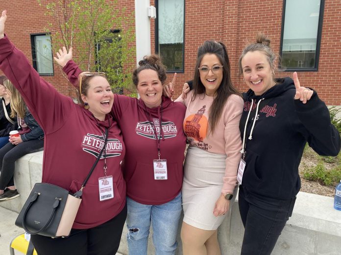 As organizer of the Peterborough Petes community watch party at Quaker Foods City Square held on May 19, 2023, the Peterborough Downtown Business Improvement Business Association (DBIA) was well represented by (from left) marketing and communications coordinator Amanda McBain, vibrancy manager Hillary Flood, DBIA board member Tiffany Arcari, and programs and engagement coordinator Shivaan Burke.  (Photo: Paul Rellinger / kawarthaNOW)