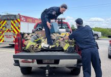 At Fire Station 2 in Port Hope on May 24, 2023, members of Port Hope Fire and Emergency Services prepare hundreds of used firefighting equipment items that were donated to Firefighters Without Borders Canada. (Photo courtesy of Municipality of Port Hope)