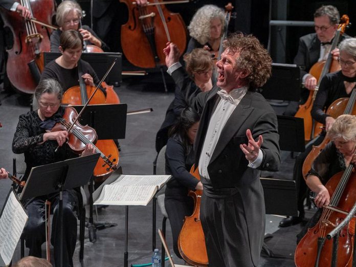 The Peterborough Symphony Orchestra's music director Michael Newnham conducts the orchestra during its February 2019 concert at Showplace Performance Centre in downtown Peterborough. On May 27, 2023, the orchestra will perform "Welcome to the Dance", the final concert in its 2022-23 season. (Photo: Huw Morgan)