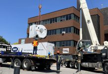 A crane lifts the community's new five-tonne MRI machine in preparation for installation at Ross Memorial Hospital in Lindsay on May 29, 2023. (Photo courtesy of Ross Memorial Hospital Foundation)