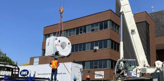 A crane lifts the community's new five-tonne MRI machine in preparation for installation at Ross Memorial Hospital in Lindsay on May 29, 2023. (Photo courtesy of Ross Memorial Hospital Foundation)