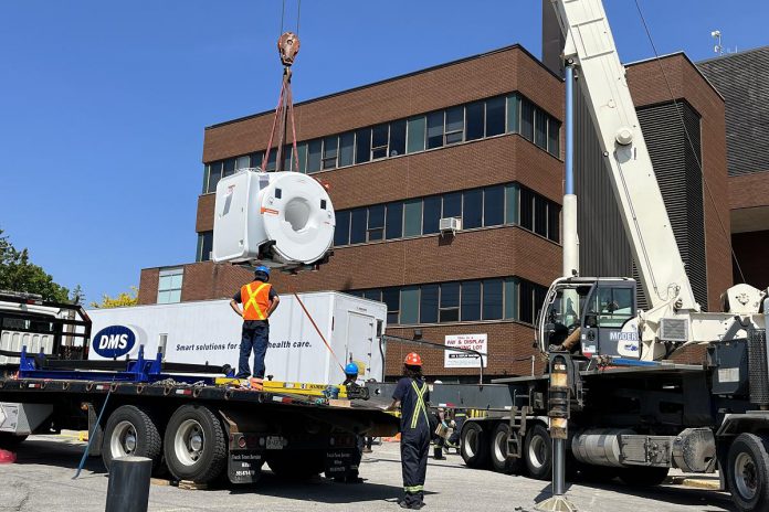 A crane lifts the community's new five-tonne MRI machine in preparation for installation at Ross Memorial Hospital in Lindsay on May 29, 2023. (Photo courtesy of Ross Memorial Hospital Foundation)