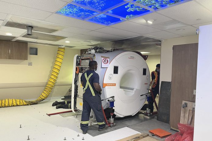 A precision moving team inserted the new MRI machine through an open wall into the renovated MRI room at Ross Memorial Hospital in Lindsay. (Photo courtesy of Ross Memorial Hospital Foundation)